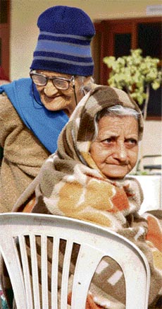 Satyawati Sharma (left) and Sudha Mohan enjoy the sunshine in the autumn of their lives at Nirmal Dham in Karnal.