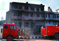 Fire tenders try to douse flames in a shoe factory at Udyog Nagar in Mangolpuri in Capital on Sunday.