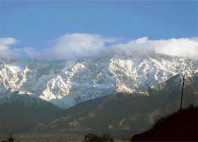 The sun illuminates the snowcapped Dhauladhar ranges near Palampur on Sunday morning