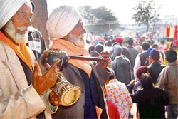 Lal Singh and Gurdev Singh, who have been playing traditional punjabi instruments for 40 years at the Maghi Mela, perform at Gurdwara Dau Sahib, Kharar