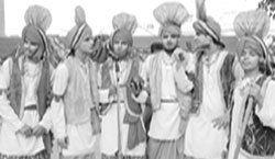 Boys perform while (right) girls wait for their turn during a cultural programme at DAV Public School in Patiala
