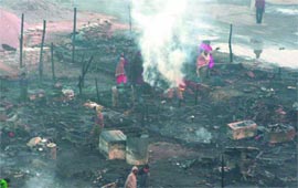 A slum cluster of Old Delhi Road Colony was razed by a fire on Sunday mid-night. 