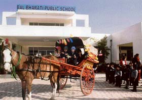 Students of Bal Bharti Public School take a ride on a horse cart in Ludhiana on Monday.