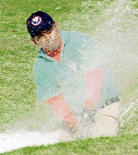 Shahid of Bangladesh is caught in a bunker on the ninth hole on the second day of the LG All-India Amateur Golf Championship at the Chandigarh Golf Club on Tuesday.