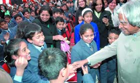 Former President Dr A.P.J Abdul Kalam with children during the annual cultural festival at Salwan Montessari School in the Capital on Tuesday. 