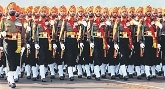 Soldiers from the Sikh Regiment march during the Army Day parade in New Delhi on Tuesday. The day commemorates the late Field Marshal B. C. Cariappa's taking over as the first Indian commander-in-chief of the armed forces in 1949, two years after India's independence from British rule.