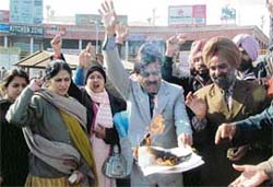 Members of the PCCTU burn copies of the Punjab Affiliated Colleges Security of Service Bill-2007 in Amritsar on Tuesday.