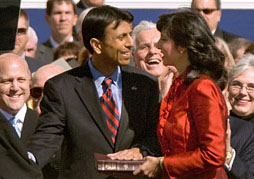 Louisiana Governor Bobby Jindal smiles at his wife Supriya Jindal after taking the oath of office in Baton Rouge on Monday.