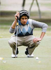Seventeen-year-old Kanishk Madan views the angle before putting on the final hole in the Indian Open Amateur Golf Championship at the Chandigarh Golf Club