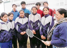 The coach (extreme right) guides young badminton players, who have been selected for the National Games (under-19) being held at Tau Devi Lal Stadium in Panchkula