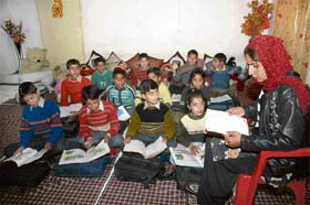 Orphans of militant violence studying in a room