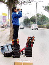 A man looks through a pair of binoculars on sale in Ludhiana