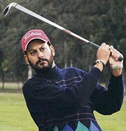 H.S. Kang of Chandigarh sees as his drive lands safely in the All-India Open Amateur Golf Championship at the Chandigarh Golf Club on Thursday.