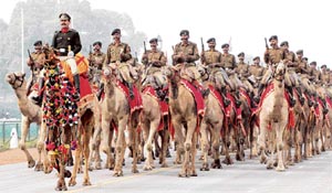 Soldiers from the BSF ride camels during a rehearsal for the upcoming 59th Republic Day parade in New Delhi on Thursday.