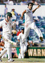 RP Singh (L) celebrates the wicket of Australia's Brett Lee; Ishant Sharma is delighted after dismissing Australia's captain Ricky Ponting during day two of the third Test at WACA stadium in Perth on Thursday.