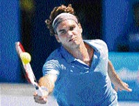 Switzerlands Roger Federer in action against Frances Fabrice Santoro at the Australian Open
