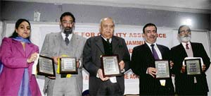 Governor and Chancellor of the University of Jammu, Lt-Gen S.K. Sinha(retd), Amitab Mattoo, Vice-Chancellor, and other officials releasing a souvenir on the university campus in Jammu on Friday