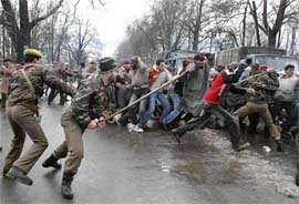 The Jammu and Kashmir Police cane-charges and arrests Kashmiri Shiite Muslims during a procession ahead of Muharram in Srinagar on Friday.