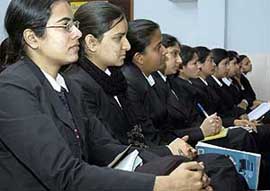 Girls listen to the speech of Canadian delegate at a seminar organised at MTSM Girls College in Ludhiana on Friday. 