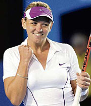 Australias Casey Dellacqua rejoices after beating former champion Amelie Mauresmo of France in the Australian Open on Friday.