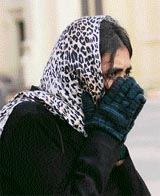 A lass tries all that she can to save herself from the chilly winds that lashed Shimla