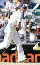 Irfan Pathan takes a stump as a souvenir.