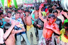 Religious Fervour: Shiites flagellate themselves during the procession. 
