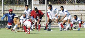 A match in progress between Guru Nanak Dev University, Amritsar, and Kurukshetra University, during the North Zone Inter-Varsity Hockey Tournament for Men being played in Ludhiana on Sunday. 