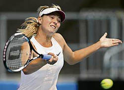 Russias Maria Sharapova hits a return to compatriot Elena Dementieva during the pre-quarterfinal of the Australian Open in Melbourne on Sunday. Sharapova won 6-2, 6-0.
