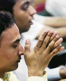 Stock traders at a brokerage firm in Mumbai