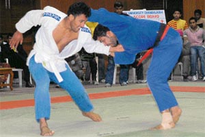 A bout in progress during the All-India Inter-University Judo (Men) Championship at Panjab University gymnasium hall in Chandigarh on Monday.