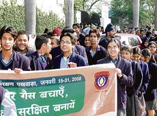 Students of Sanjay Public School-44 hold placards with message for conserving oil and natural gas during a rally organised by the ONGC in Chandigarh on Monday.