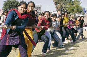 Girls participate in a tug-of-war contest during the annual sports and athletics meet at Devki Devi Jain Memorial College for Women in Ludhiana on Monday. 