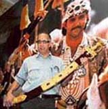 Tanishq COO C.K. Venkatraman poses with the sword used in the film Jodhaa Akbar during the display of Tanishq jewellery made for the film, in New Delhi on Tuesday.