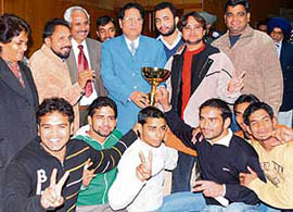 Panjab University judokas with the vice-chancellor after winning the overall title during the All-India Inter-Varsity Judo Championship in Chandigarh on Tuesday. 