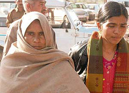 Snehlata being escorted by the police at the Panchkula district courts on Tuesday.