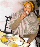 A member of the Dalit-A Mahapanchayat, Haryana, who had been sitting on fast for the past nearly one month, has his food at a dhaba in Rohtak on Tuesday.
