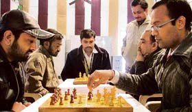 DMC employees participate in a chess championship during the annual sports meet in Ludhiana on Tuesday. 