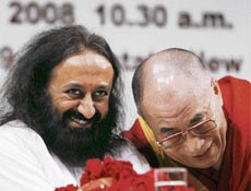 Tibetan spiritual leader Dalai Lama speaks with guru Sri Sri Ravi Shankar during the launch ceremony of the Global Foundation for Civilisational Harmony (India) in New Delhi on Tuesday.