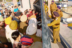 Shopkeepers outside PUDA building in Mohali