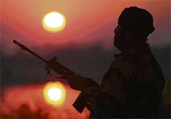 A paramilitary soldier stands guard ahead of Republic Day in Jammu on Wednesday.