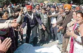 Shopkeepers of Phase 3B1 rehri market protest outside the GMADA building in Mohali