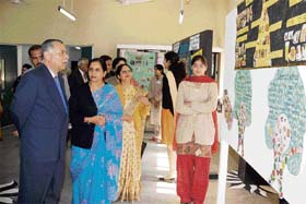 Adviser to UT Administrator Pradip Mehra takes a look at posters during an exhibition at Government Home Science College, Sector 10, Chandigarh