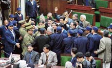 National Conference legislators surrounded by marshals during their protest near the well of the House in Jammu on Thursday. 