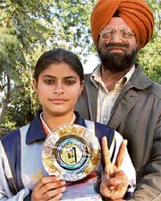 Manvir Kaur with her coach J.S. Bhandari.