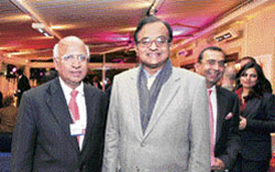 Finance minister P. Chidambaram with CEO and managing director of TCS, S. Ramadorai, at the World Economic Forum in Davos, Switzerland