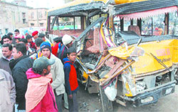 Mangled remains of the school bus which was hit by a truck on Nawanshahr-Jalandhar road