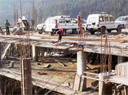 Construction on the controversial bus stand site at McLeodganj continues despite a ban by the empowered committee of the Supreme Court.