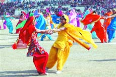Girls perform giddha during the Republic Day parade at Guru Gobind Singh Stadium in Jalandhar on Saturday. 