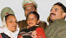 IG Sanjiv Kalra hand over the rescued child to parents in Ludhiana on Sunday.